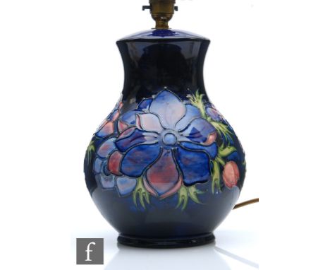 A large Moorcroft table lamp decorated in the Anemone pattern, complete with Moorcroft shade, impressed marks, height 32cm in