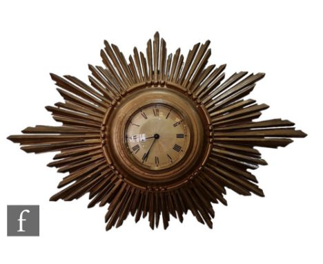 An Art Deco period 'Sunburst' wall clock, radiating Swiss dial, height 31cm, width 48cm.