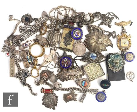 A parcel lot of assorted hallmarked silver and white metal items to include bracelets, fobs, ingots, earrings, crosses, decan