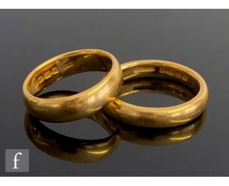 Two 22ct hallmarked D shaped wedding rings, total weight 14.3g, sizes K and P. (2) 