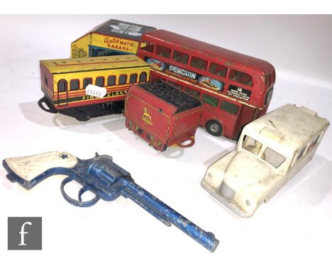 A Triang Minic tinplate clockwork Double Decker Bus circa 1950, in red with cream upper deck window surrounds, Putney destina
