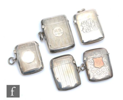 Five assorted hallmarked silver rectangular vesta cases to include plain, foliate and engine turned examples, various dates a