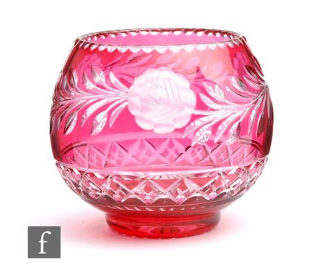 A large 20th Century continental crystal glass bowl cased in ruby over clear and flash cut with a band of stylised flowers an