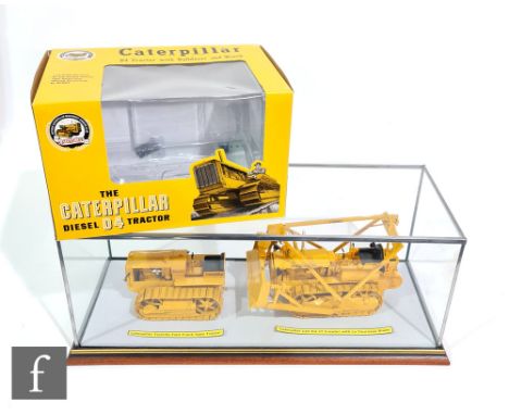 Two 1:16 scale diecast Caterpillar model tractors to include an Antique Caterpillar Machinery Owners Club D4 tractor with bul