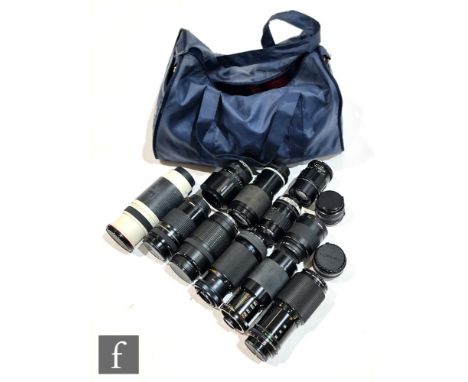 A collection of camera lenses and accessories, to include a Cosina 400mm f.4.5-6.7 super telephoto lens, Canon 35mm f2.8, 210