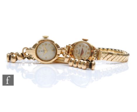 Two 9ct hallmarked lady's manual wind wrist watches to include a Tudor example, each to a gilt metal bracelet. (2) 