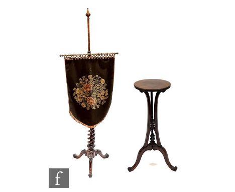 A Victorian rosewood pole screen, with machine woven shield shaped banner with velvet backing to the open twist support, over