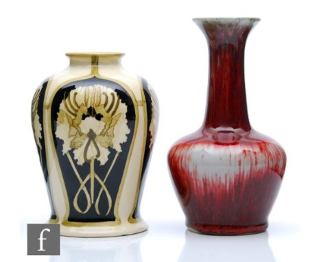 Two Cobridge Pottery vases, the first decorated with panels of flowers against a black ground, the design by&nbsp;Kerry Goodw
