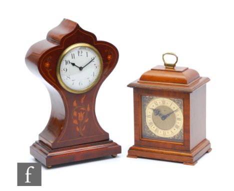 An Edwardian Art Nouveau style inlaid mantle clock, circular Arabic dial, on stepped base, height 28cm, and a small 1960s mah