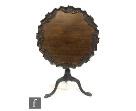 A 19th Century and later mahogany snap top supper table, with acanthus and shell carved detail to the cartouche border, all o