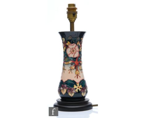 A Moorcroft Pottery table lamp decorated in the Oberon pattern designed by Rachel Bishop, marks obscured by affixed wooden pl