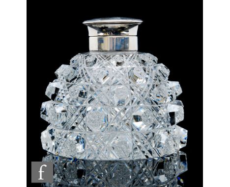 A large early 20th Century Stourbridge clear cut crystal inkwell, the domed body cut in high relief with a variant of the hob