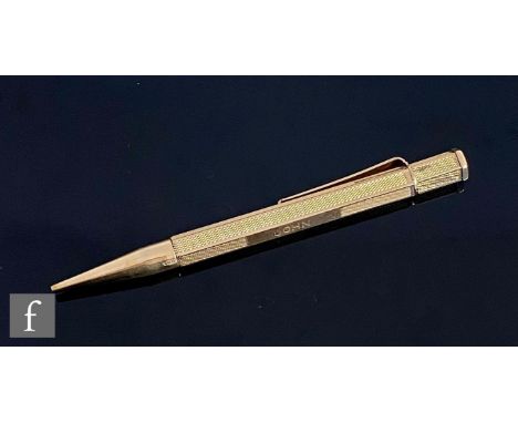 A 9ct hallmarked retractable pencil, hexagonal case with engine turned decoration, case engraved 'John', weight 23g, length 1