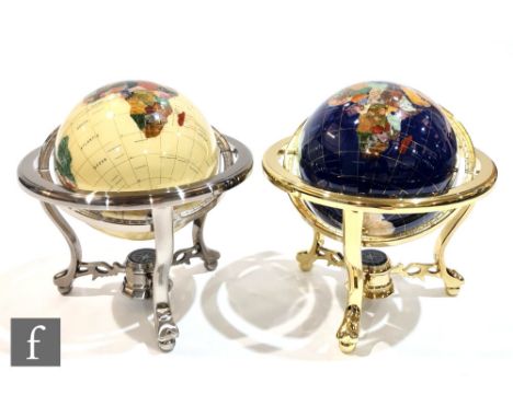 A pair of modern brass framed table globes, each in a suspended frame, each inset with lapis lazuli and other stones, each wi