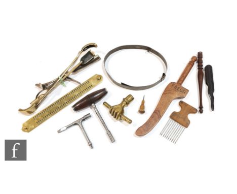 A 19th Century brass safe key in the form of a clasped hand, a British Rail carriage door key and piano tuner's key and a bra