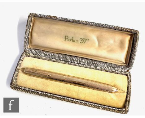 A cased 9ct hallmarked Parker 51 fountain pen with engine turned decoration and engraved initials A.F.D to cartouche, length 
