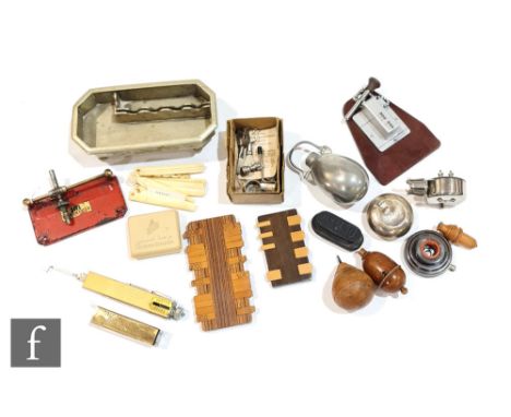 Two wooden cribbage markers, a muff warmer, a travelling plated inkstand, a selection of baby's bone teething tools, wooden p