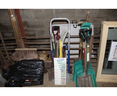 A bundle of gardening tools and a sack barrow 