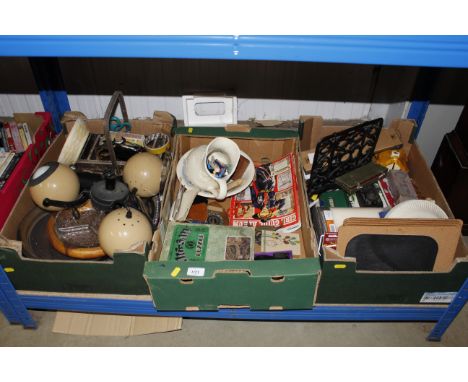 Three boxes of miscellaneous decorative and other items to include jigsaws puzzle, placemats, games, kitchenalia. pendent lig
