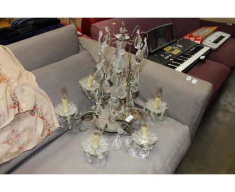 A gilt metal and glass six light chandelier