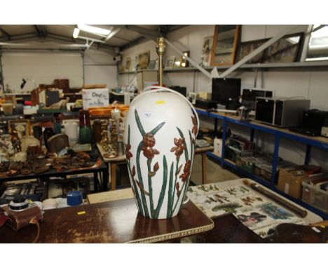 A table lamp of floral design 