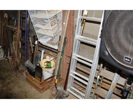 A bundle of long handled gardening tools 