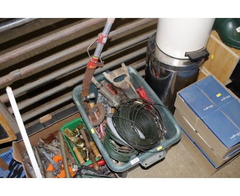 A box containing various hand tools and wire