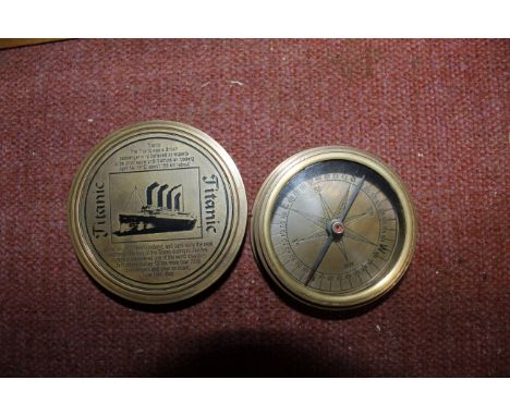 A brass pocket compass with Titanic decoration