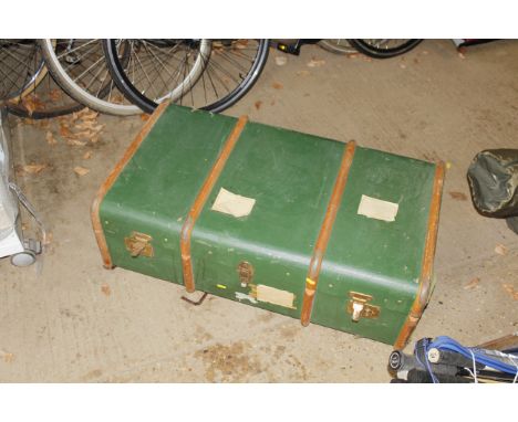 A wooden and metal bound travelling trunk