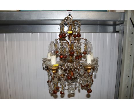 A five light chandelier with coloured and clear glass drops