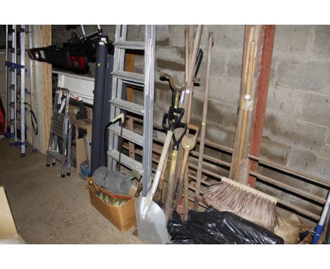 A bundle of long handled gardening tools 