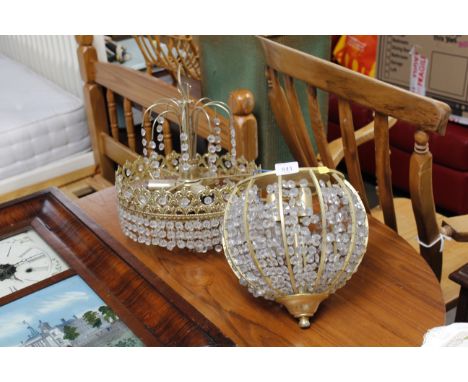 Two brass and glass pendent light fittings