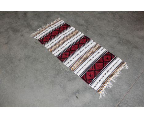 An approx. 4'9" x 1'11" Kilim runner