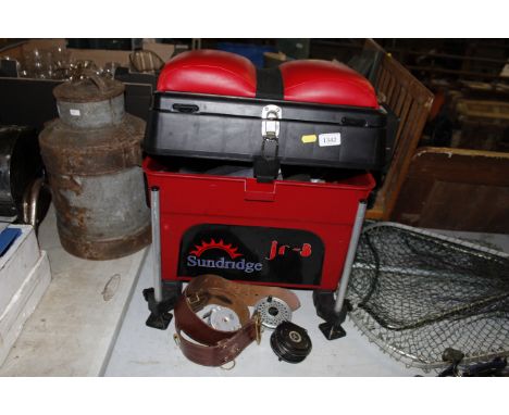 A Sundrig fishing tackle seat box and contents of various fishing tackle to include three fly fishing reels