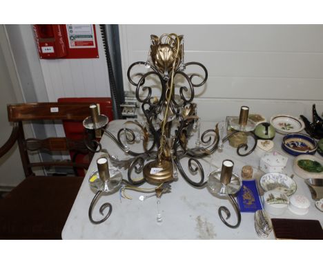 A five branch light fitting with glass drops