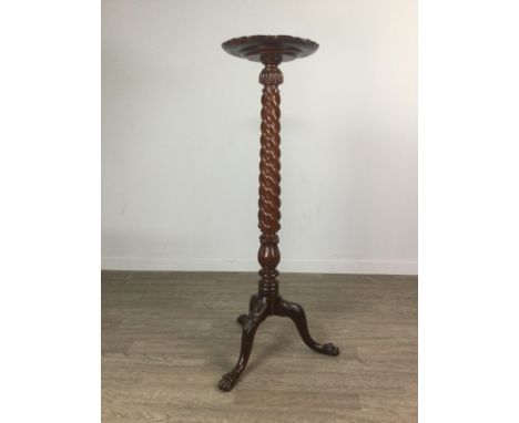 REPRODUCTION MAHOGANY TORCHERE, the dished scalloped stand over a spiral twist column, on tripod acanthus and paw feet, 125cm