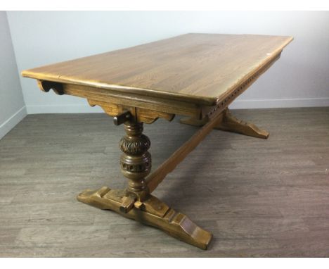 OAK REFECTORY DINING TABLE, in the manner of Ercol, on twin pillar suppots joined by a stretcher, 183cm x 92cm