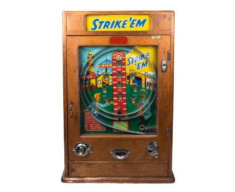 An impressive Penny Arcade machine. This example probably of 1950’s British manufacture is called ‘Strike’Em’ measures 89cm t