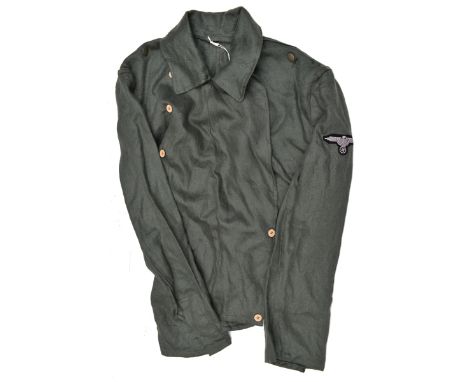 A Third Reich panzer style dark green herring bone weave pocketless jacket,  with single row of sewn on pressed paper buttons