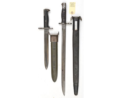 A US 1917 Remington bayonet, blued blade with stamps at forte, cleaning hole in pommel, in scabbard with swivel attachment; a