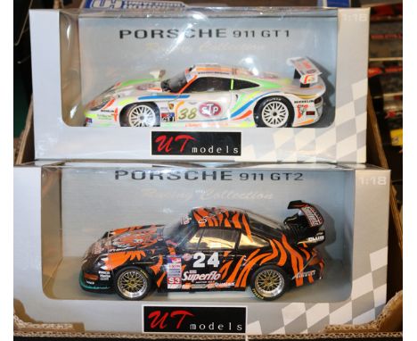 3 1:18 scale racing cars. 2x UT Models Le Mans style Sports GT – Porsche 911 GT2 in black/orange tiger stripes Superflo liver