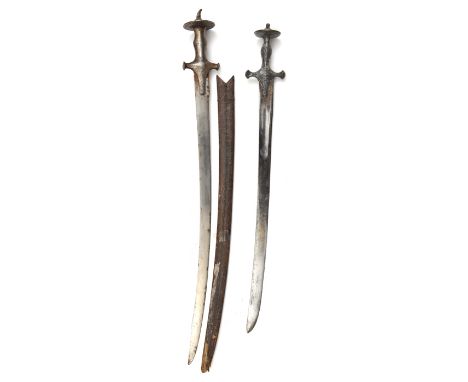 A tulwar,  shortened blade 23”, iron hilt chiselled with animals and foliage, and another, curved blade 27”, plain iron hilt,