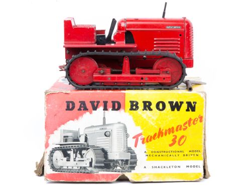 A rarely seen Shackleton Model David Brown Trackmaster 30 crawler tractor. A heavy die-cast and tinplate wind-up ‘Constructio