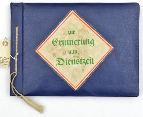 A Third Reich photograph album,  the cover with coloured panel inscribed “Zur Erinnerung a.m. Dienstzeit”, containing over 80