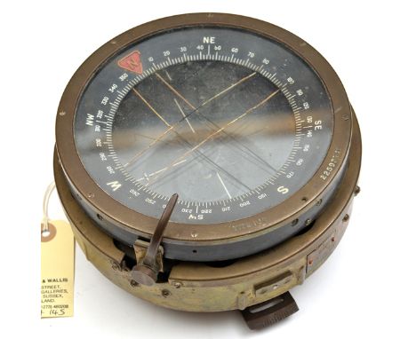 A WWII period Type P10 aircraft compass, diam 6½” brass rim marked “Type P10” and “No 22593TM”, spring mounted onto brass bas