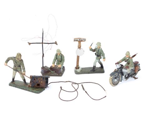 4 Elastolin German Army figures. Rare motorcycle outrider, soldier with radio set, soldier banging gas alert gong and soldier