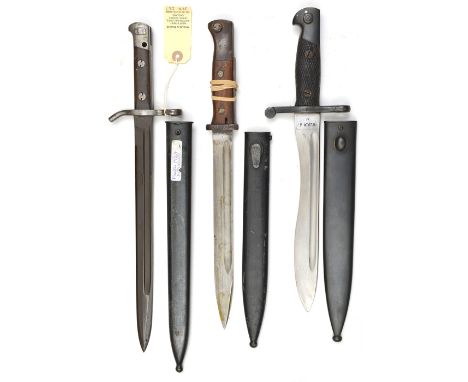 A Finnish M1927 bayonet, marked Fiskars at forte, in scabbard; a Spanish M1941 Bolo bayonet, stamps at forte, in scabbard; bo