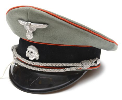 A Third Reich SS Artillery (?) officer’s peaked cap, of light field grey cloth with black velvet band, red piping, black fibr