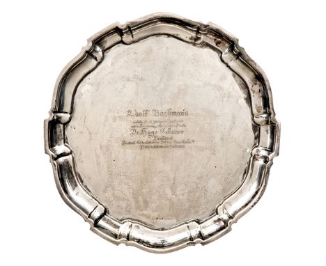 A presentation silver tray, with gadrooned border and 835 purity mark. Engraved “Adolf Bachmann verliehe ich all Zereichen de