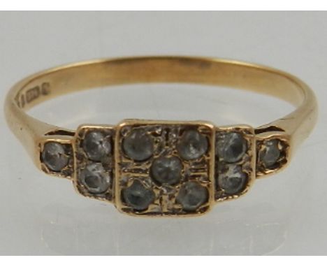 A 9 carat yellow gold and diamond stepped cluster ring, set nine round cut stones. 